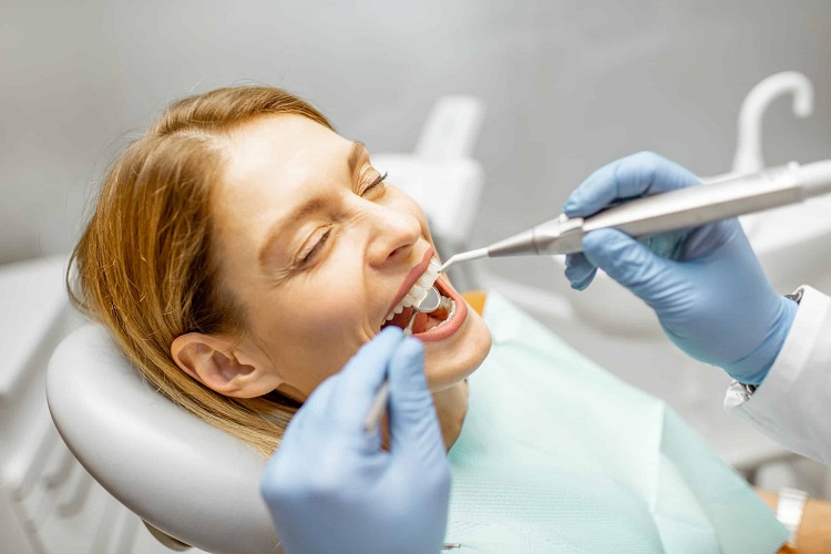 woman-during-a-teeth-inspection-at-the-dental-offi-2022-01-18-23-45-11-utc-scaled