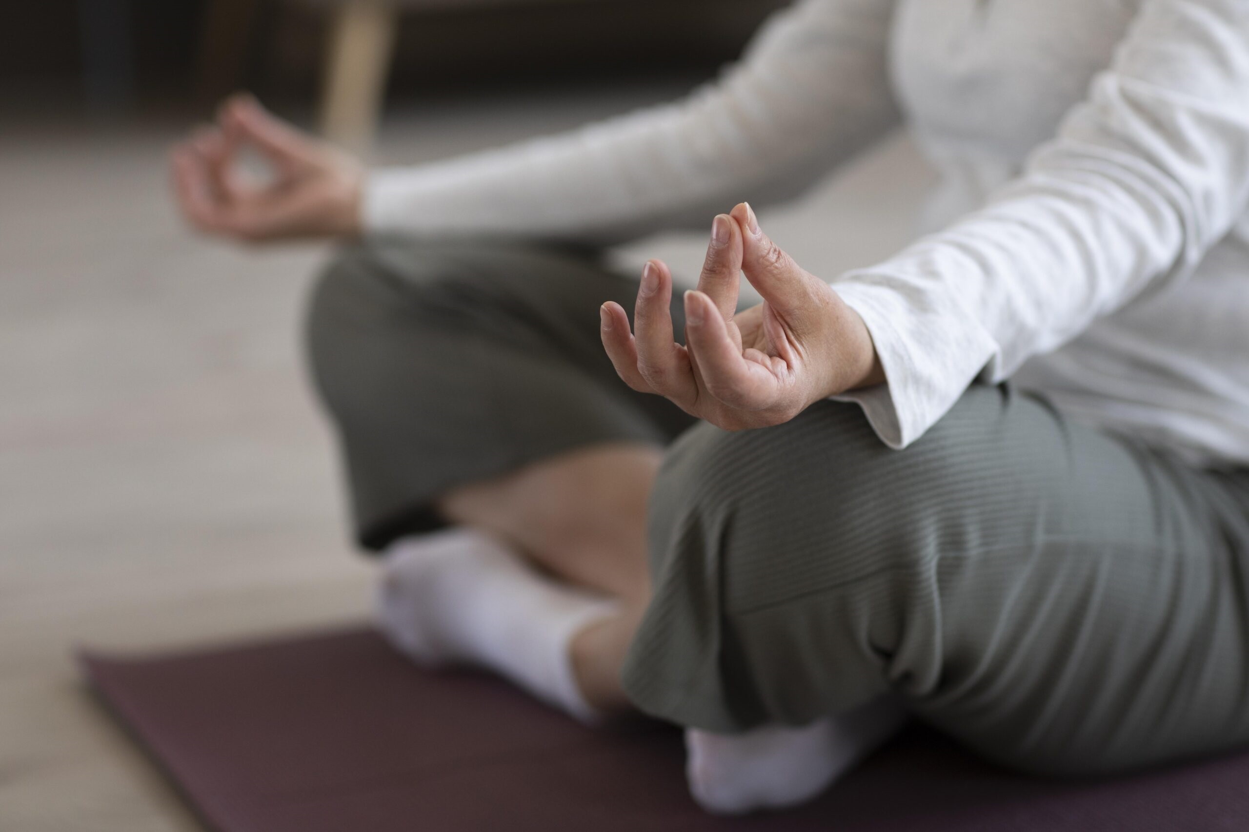 close-up-person-meditating-home-scaled