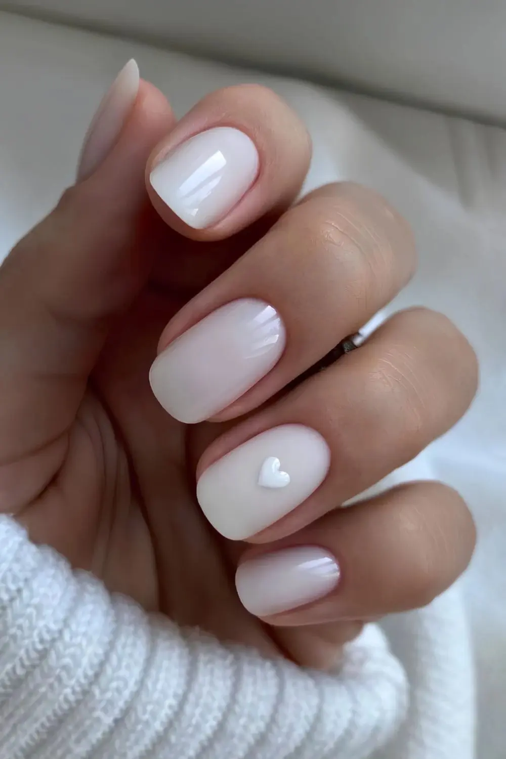 Short-white-mani-with-minimalist-heart-art