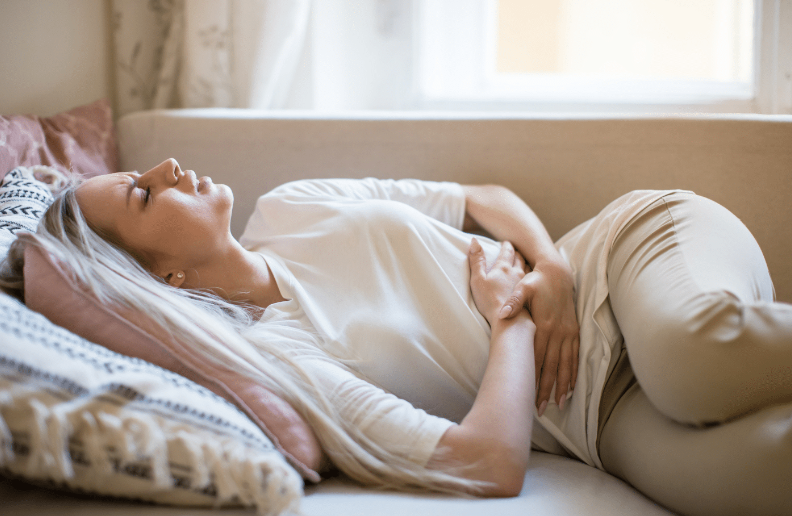 Bowel_WomanLyingOnBackInPain_png_1500×1000_10_22_2024_12_25_PM