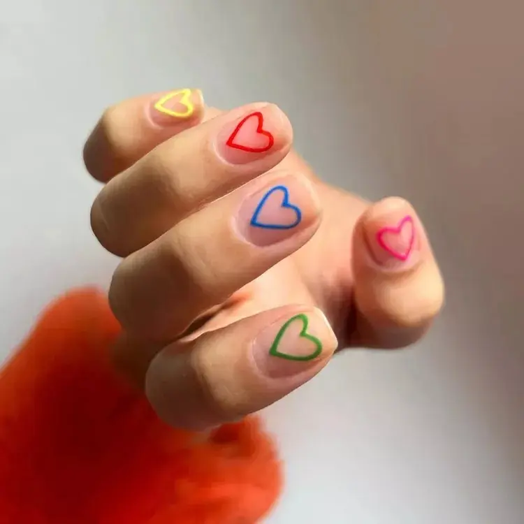 Minimalist-Matte-Rainbow-Heart-Nails-InStyle-Heart-Nail-Ideas-e1769089876e4553afe4095262885f42