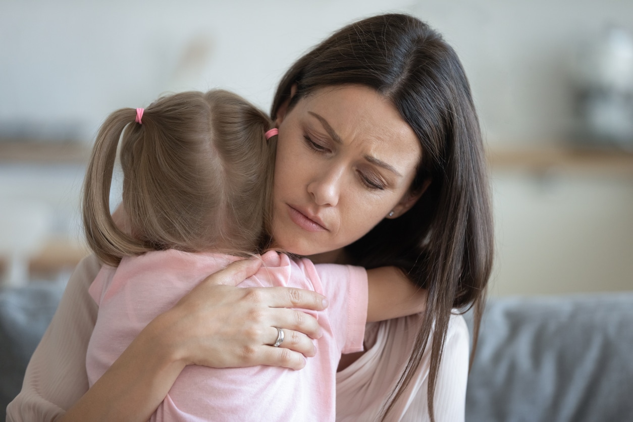 Worried-young-foster-mother-comforting-embracing-adopted-child-daughter-1191083789_1258x838