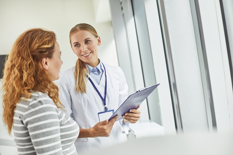 doctor-speaking-to-a-young-woman-during-an-appointment