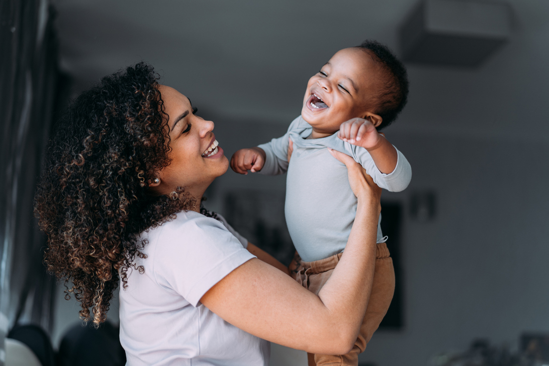 Mother with laughing baby