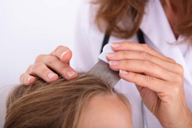 doctor-inspecting-a-girls-scalp-to-determine-if-it-s-lice-or-dandruff