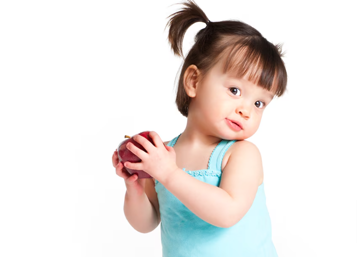 girl_holding_apple_and_smiling_png_1200×675_10_16_2024_03_45_PM
